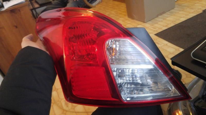 Left taillamp assembly used genuine OEM Nissan Versa 2012-2019