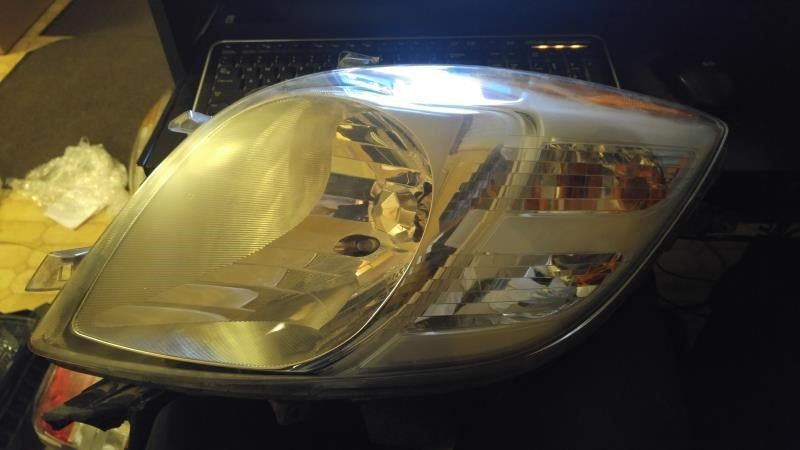 Left headlamp assembly composite used genuine OEM Toyota Yaris 2006-2008