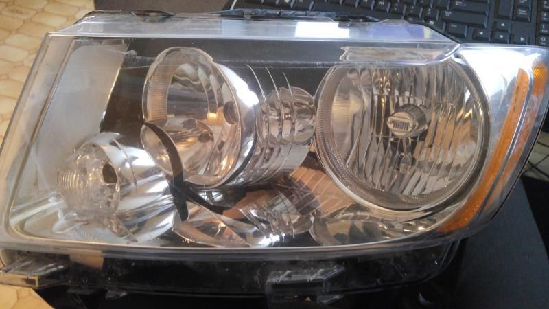 Left headlamp assembly composite used genuine OEM Jeep Grand Cherokee 2011-2013