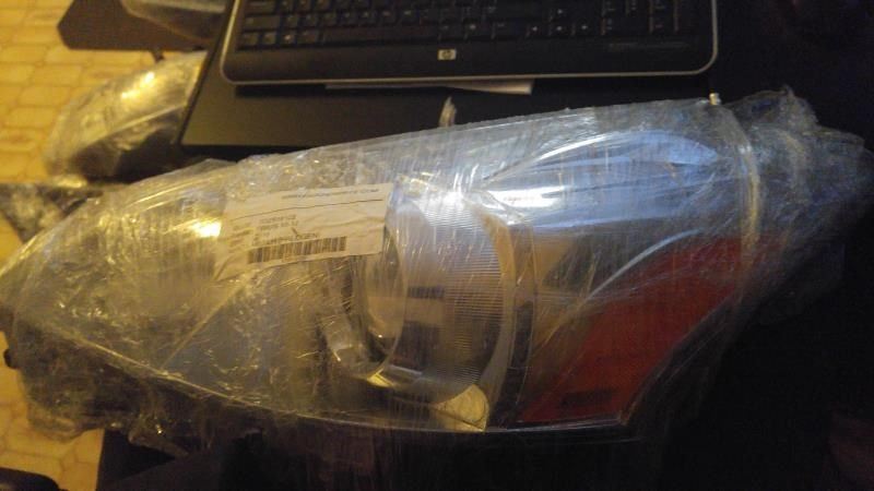 Left headlamp lens/housing used genuine OEM Toyota Prius 2012-2015
