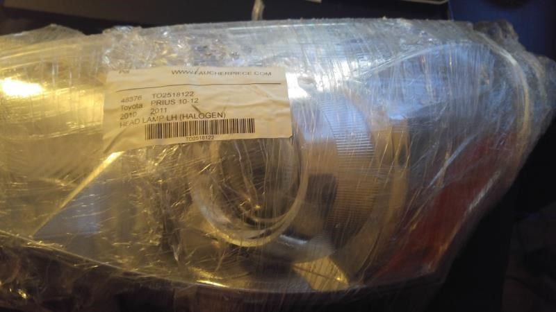 Left headlamp lens/housing used genuine OEM Toyota Prius 2012-2015