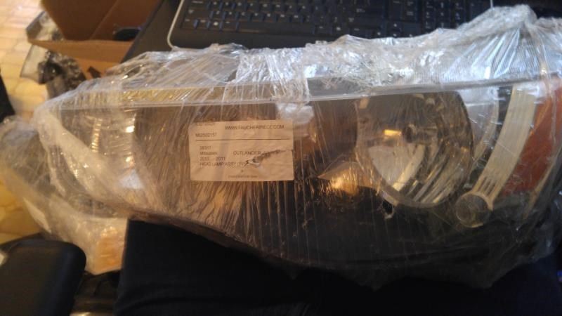 Faro usado original (OEM) Mitsubishi Outlander 2009
