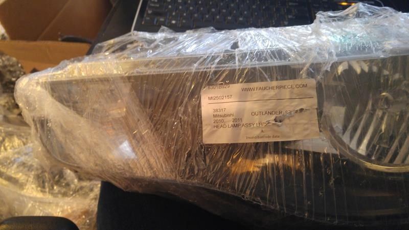 Faro usado original (OEM) Mitsubishi Outlander 2009
