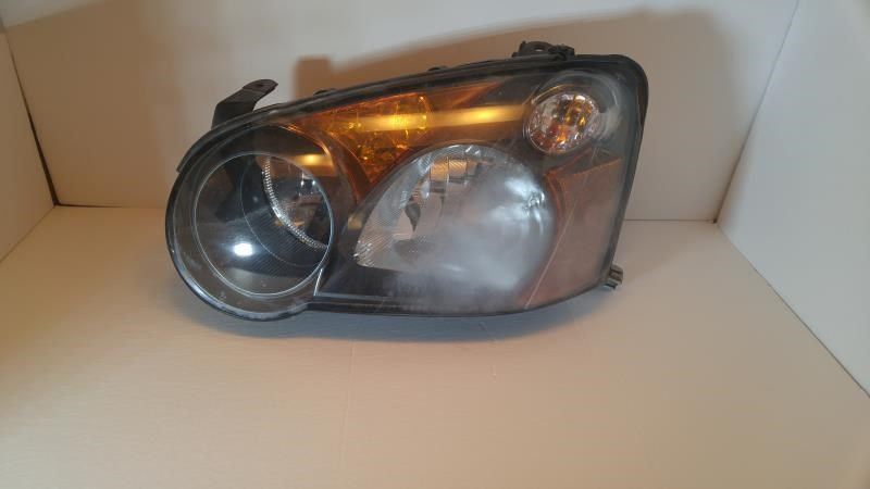 Left headlamp assembly composite used genuine OEM Subaru Impreza 2004