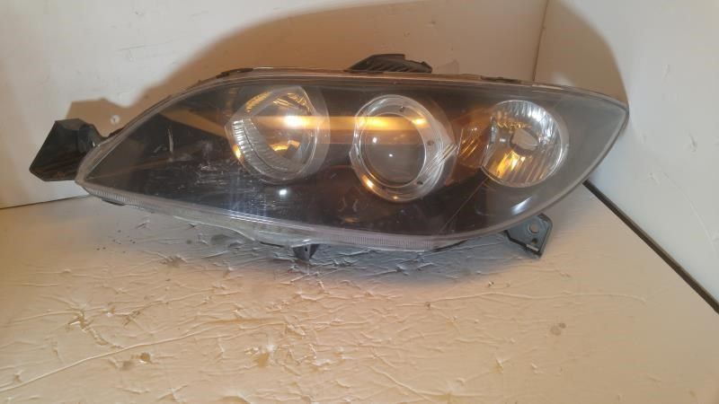 Left headlamp lens/housing used genuine OEM Mazda 3 2004-2009