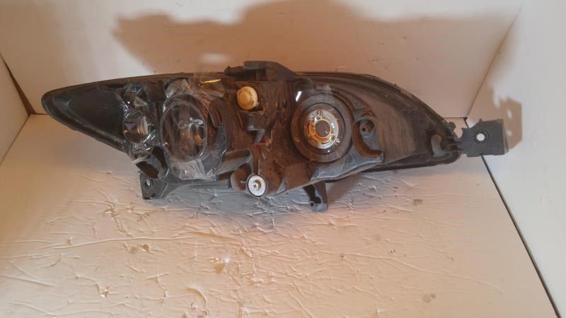 Left headlamp lens/housing used genuine OEM Mazda 3 2004-2009