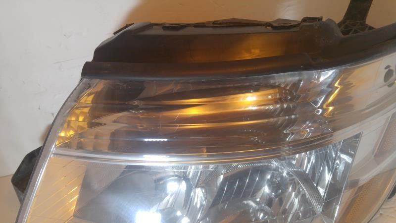 Left headlamp assembly composite used genuine OEM Ford Taurus 2008-2009