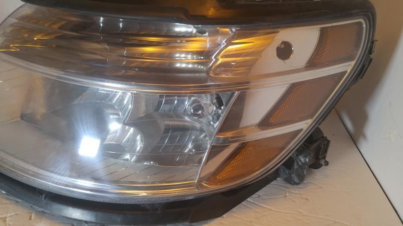 Left headlamp assembly composite used genuine OEM Ford Taurus 2008-2009