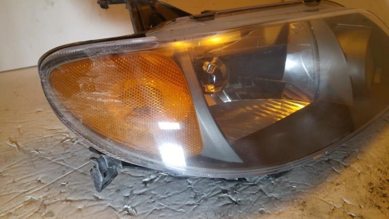 Right headlamp assembly composite used genuine OEM Mazda Protege 2001-2003