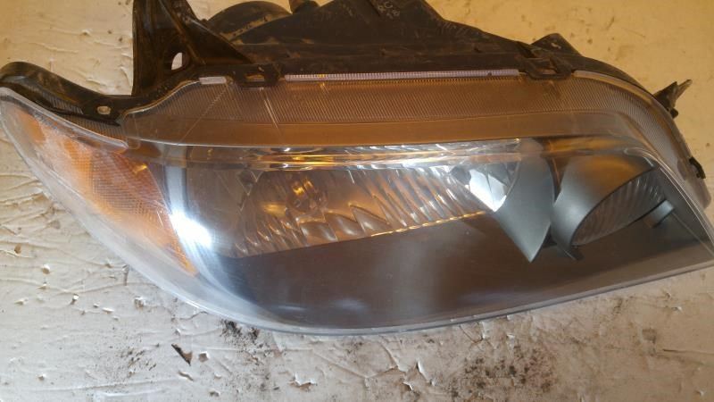 Right headlamp assembly composite used genuine OEM Mazda Protege 2001-2003