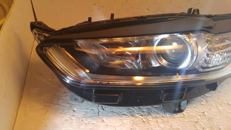 Left headlamp assembly composite used genuine OEM Ford Fusion 2013-2016
