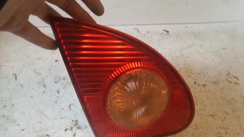 Left back up lamp assembly used genuine OEM Toyota Corolla 2003-2008