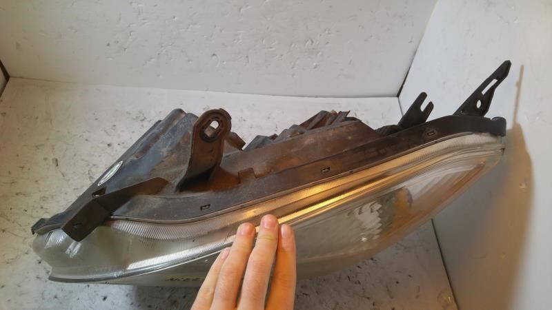 Left headlamp assembly composite used genuine OEM Nissan Rogue 2009-2010