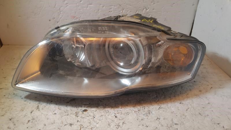 Left headlamp assembly composite used genuine OEM Audi A4 2005-2009