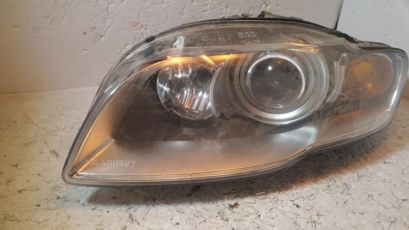 Left headlamp assembly composite used genuine OEM Audi A4 2005-2009