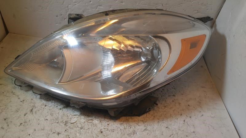 Left headlamp assembly composite used genuine OEM Nissan Versa 2012-2014