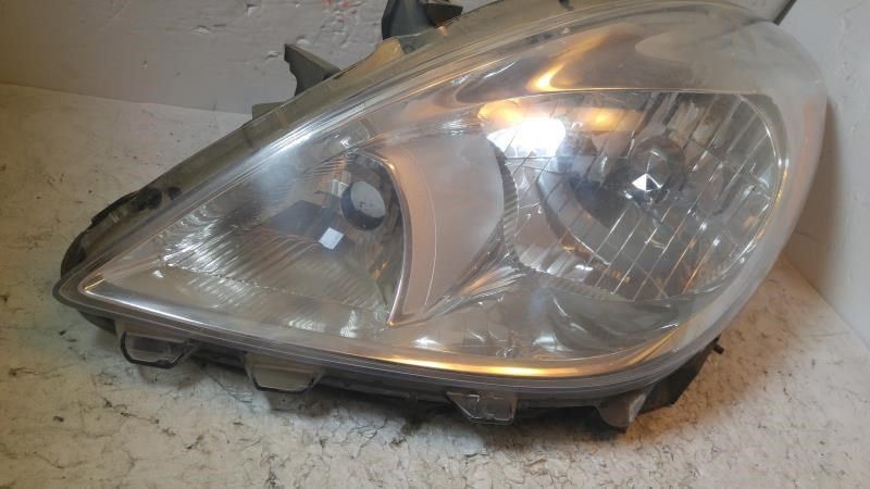 Left headlamp assembly composite used genuine OEM Nissan Versa 2012-2014