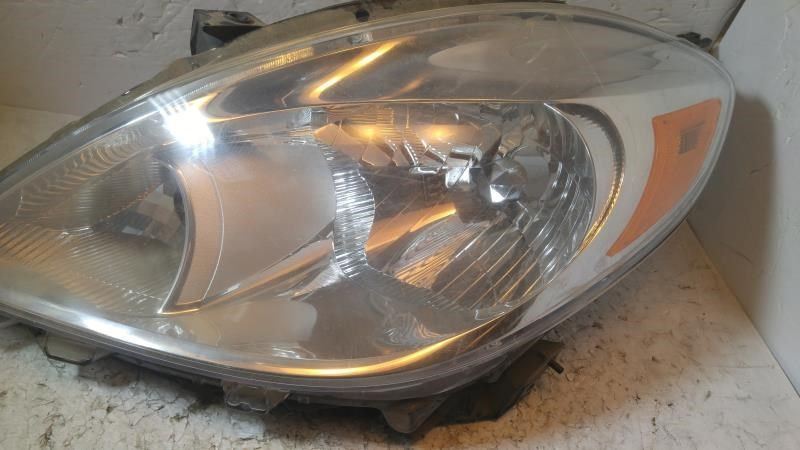 Left headlamp assembly composite used genuine OEM Nissan Versa 2012-2014