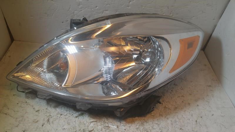 Left headlamp assembly composite used genuine OEM Nissan Versa 2012-2014