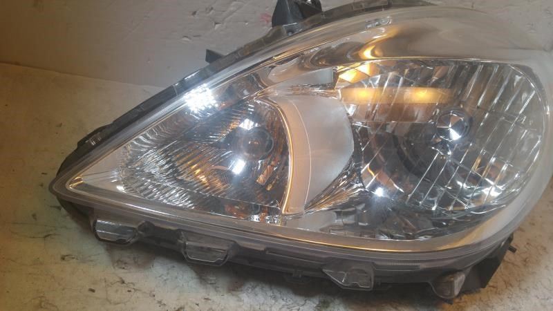 Left headlamp assembly composite used genuine OEM Nissan Versa 2012-2014