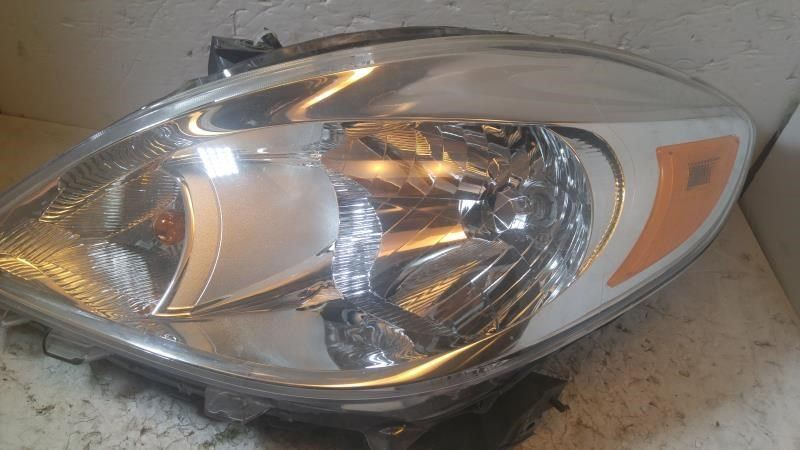 Left headlamp assembly composite used genuine OEM Nissan Versa 2012-2014