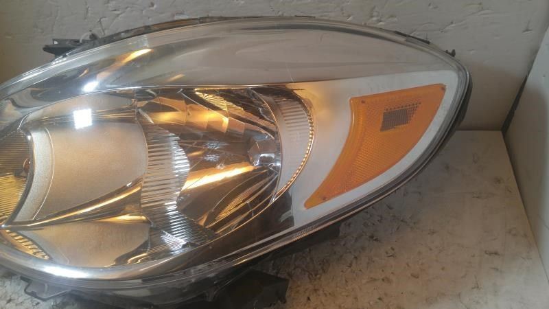 Left headlamp assembly composite used genuine OEM Nissan Versa 2012-2014