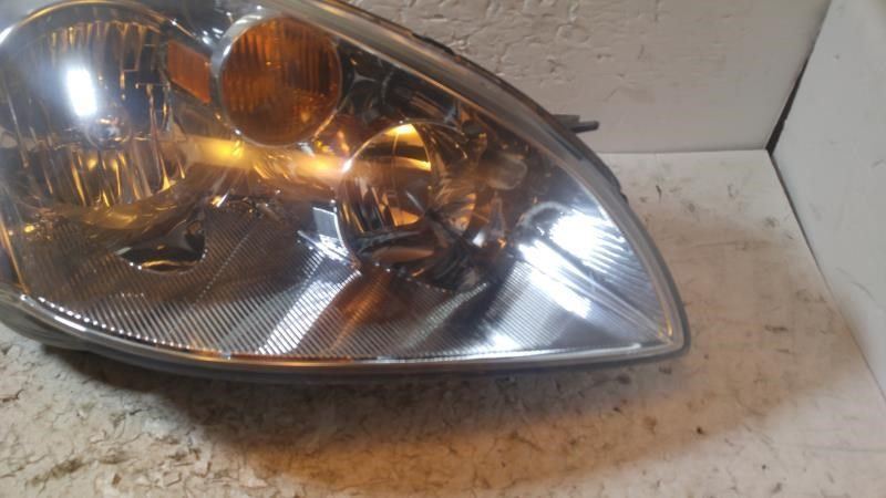 Right headlamp assembly composite used genuine OEM Nissan Altima 2005-2006