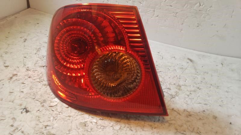 Left taillamp assembly used genuine OEM Toyota Corolla 2003-2004