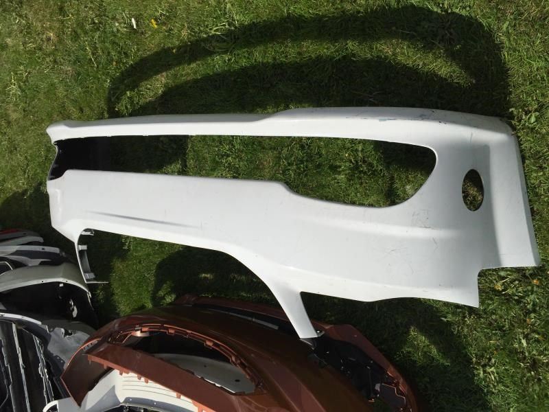 Front bumper cover used genuine OEM Dodge Grand Caravan 2011-2020