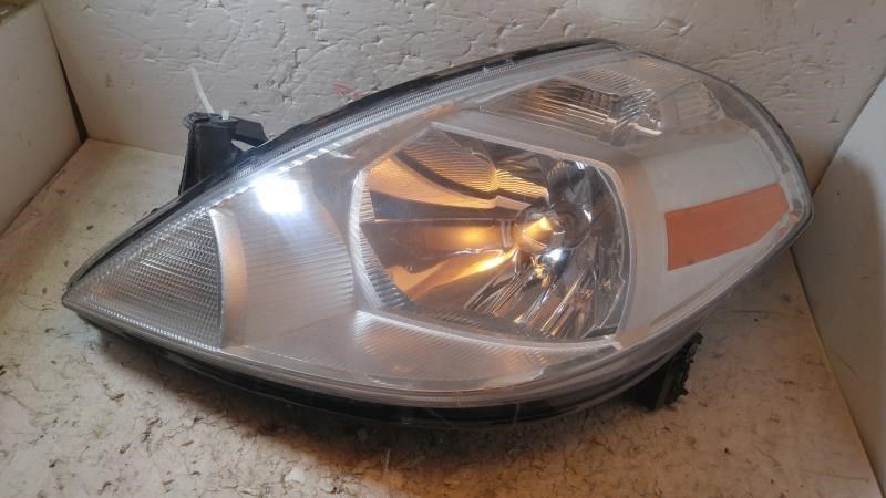 Left headlamp assembly composite used genuine OEM Nissan Versa 2007-2012