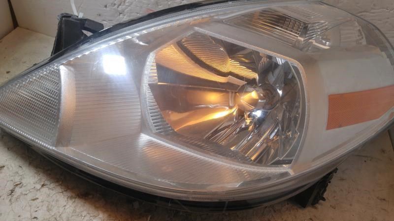 Left headlamp assembly composite used genuine OEM Nissan Versa 2007-2012