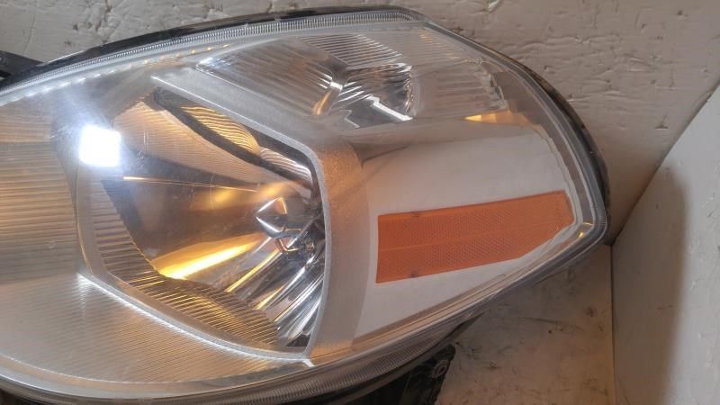 Left headlamp assembly composite used genuine OEM Nissan Versa 2007-2012