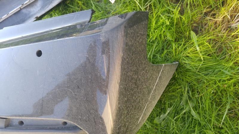 Defensa (parachoques) trasera usada original (OEM) Cadillac ATS 2013-2018