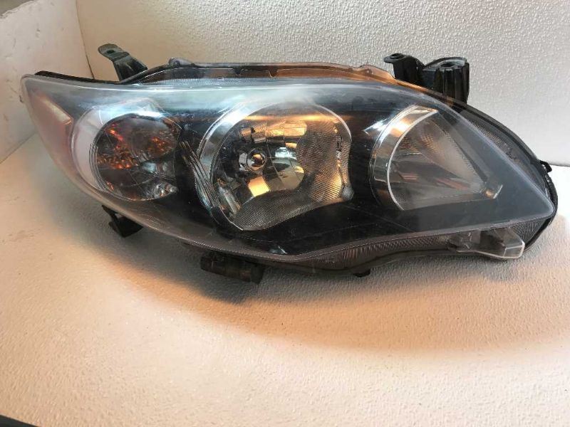 Right headlamp assembly composite used genuine OEM Toyota Corolla 2009-2010