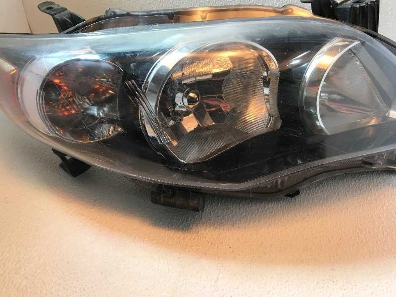 Right headlamp assembly composite used genuine OEM Toyota Corolla 2009-2010