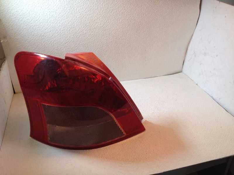 Left taillamp assembly used genuine OEM Nissan Versa 2007-2012