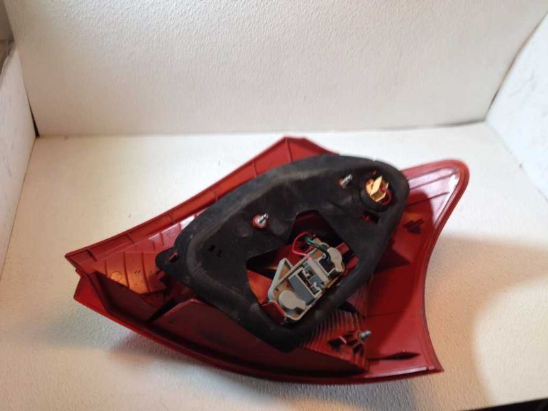 Left taillamp assembly used genuine OEM Nissan Versa 2007-2012