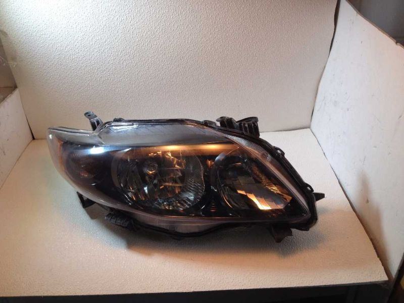 Right headlamp assembly composite used genuine OEM Toyota Corolla 2009-2010