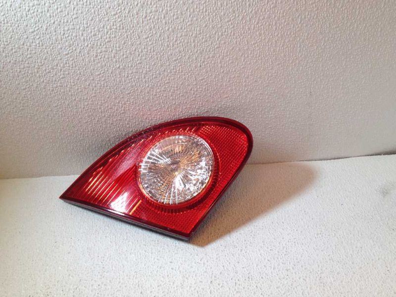 Left back up lamp assembly used genuine OEM Toyota Corolla 2003-2008