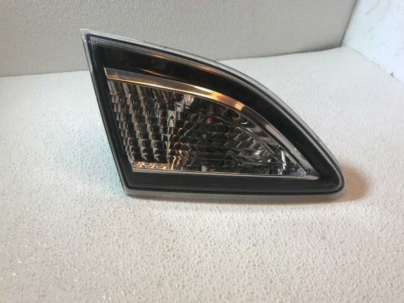 Left back up lamp assembly used genuine OEM Mazda 3 2010-2013