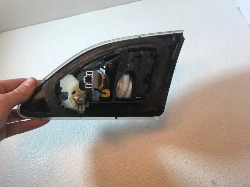 Left back up lamp assembly used genuine OEM Mazda 3 2010-2013
