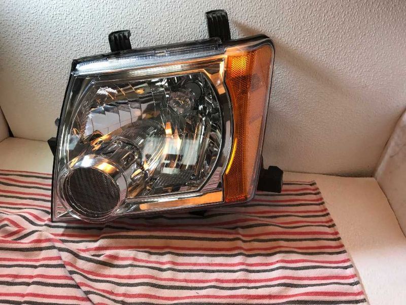 Faro izquierdo usado original (OEM) Nissan Xterra 2005-2015