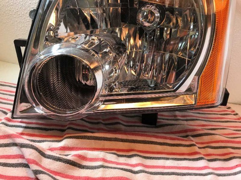 Faro izquierdo usado original (OEM) Nissan Xterra 2005-2015