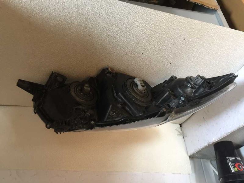 Left headlamp assembly composite used genuine OEM Toyota Corolla 2009-2010