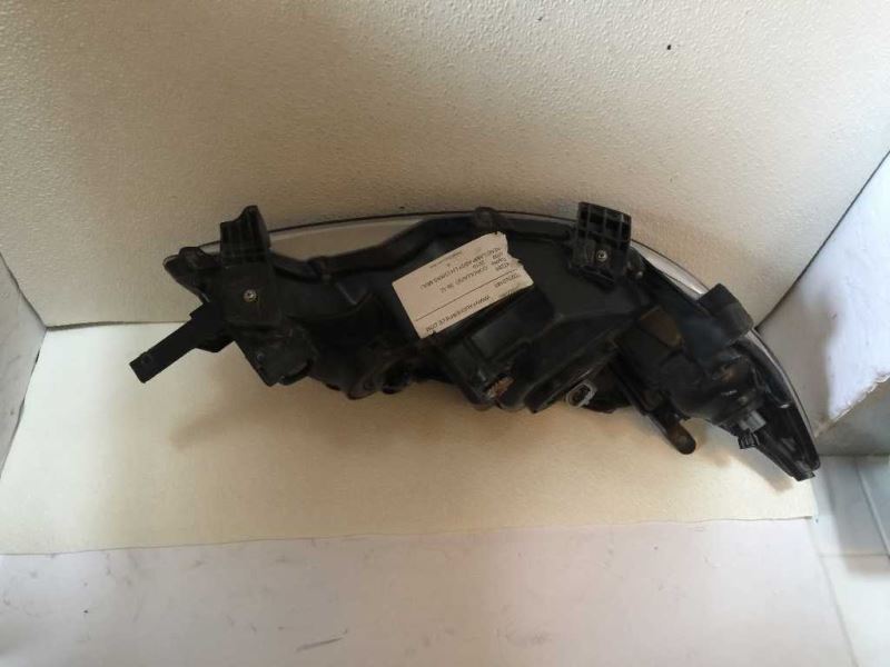 Left headlamp assembly composite used genuine OEM Toyota Corolla 2009-2010