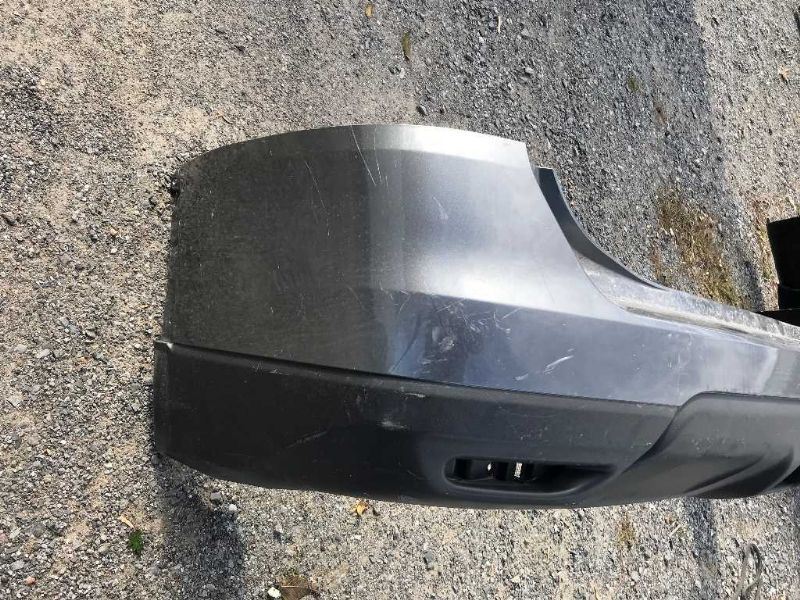 Defensa (parachoques) trasera usada original (OEM) Nissan Rogue 2014-2016