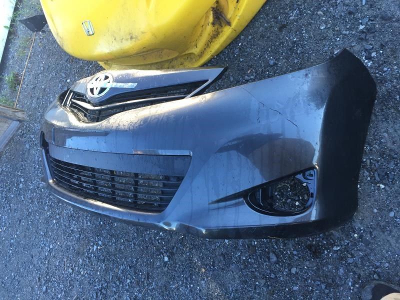Front bumper grille used genuine OEM Toyota Yaris 2012-2014