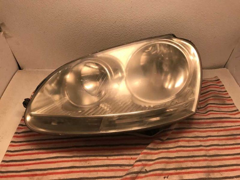 Left headlamp assembly composite used genuine OEM Volkswagen Jetta 2005-2010