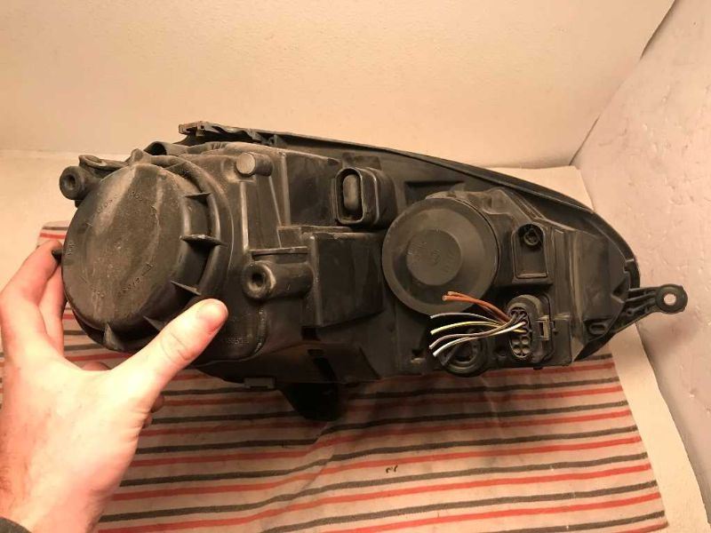 Left headlamp assembly composite used genuine OEM Volkswagen Jetta 2005-2010