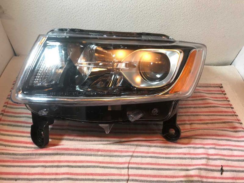 Left headlamp assembly composite used genuine OEM Jeep Grand Cherokee 2014-2016